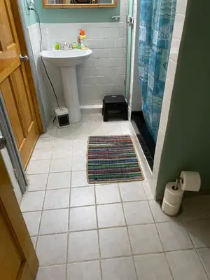 a bathroom with a sink and a shower and a toilet at Cozy charming private studio in North Bergen