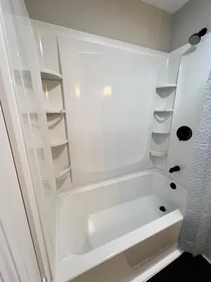 a white bathroom with a tub and shelves at Holyoke House Oasis - Calm Trips in Holyoke
