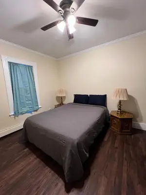a bedroom with a bed and a ceiling fan at Holyoke House Oasis - Calm Trips in Holyoke