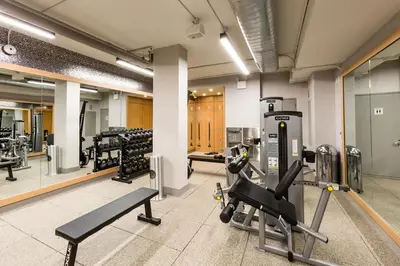 a gym with two treadmills and a treadmill at Blueground Upper East Side studio apartment NYC-1553 in New York