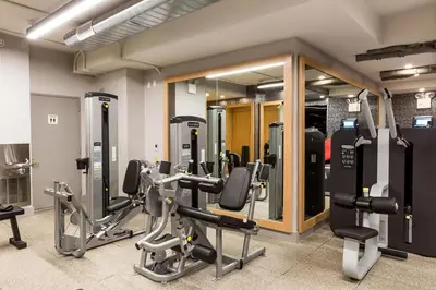 a gym with several treadmills and cardio machines at Blueground Upper East Side studio apartment NYC-1553 in New York
