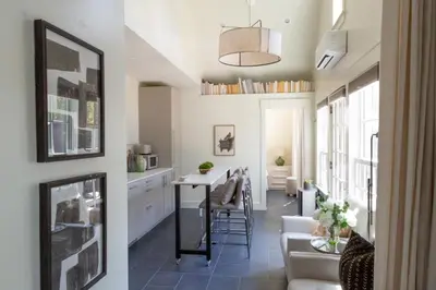 a kitchen and living room with a table and chairs at Mt Williams Retreat in Williamstown