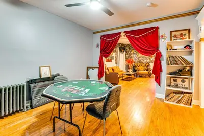a living room with a table and chairs at 15 Mi to NYC Apartment in Newark in Newark