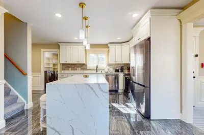 a kitchen with white cabinets and a white counter top at Near Medical Center! Remote-Work Hub in Holyoke in Holyoke