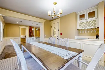 a dining room with a table and white chairs at Near Medical Center! Remote-Work Hub in Holyoke in Holyoke