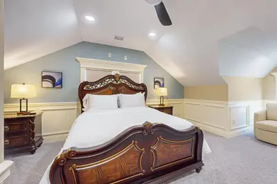 a bedroom with a large bed and a couch at Near Medical Center! Remote-Work Hub in Holyoke in Holyoke