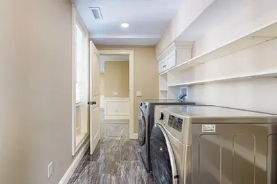a laundry room with a washer and dryer at Near Medical Center! Remote-Work Hub in Holyoke in Holyoke