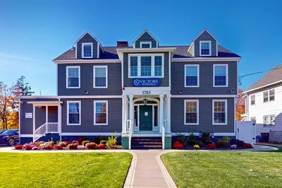 a blue house with a sign on the front of it at Near Medical Center! Remote-Work Hub in Holyoke in Holyoke