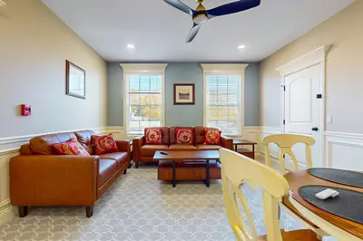 a living room with a couch and a table at Work, Play and Stay! Apt Near Holyoke Medical Center in Holyoke