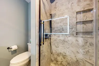 a bathroom with a shower with a toilet at Work, Play and Stay! Apt Near Holyoke Medical Center in Holyoke