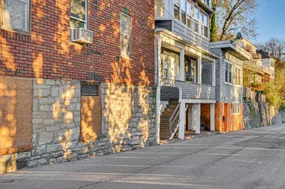 an empty street next to a brick building at NYC Area Apartment on Hudson River! in Hastings-on-Hudson