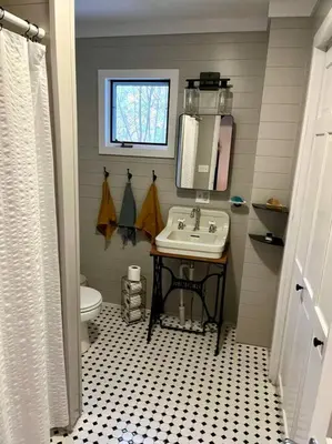 a bathroom with a sink and a toilet at Victorian Farmhouse in The Catskills in East Meredith