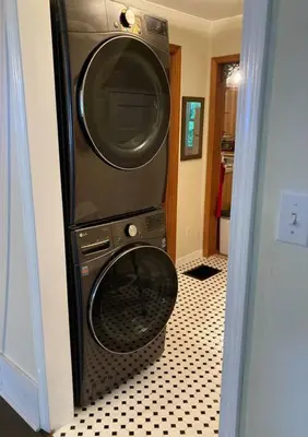 a washer and a dryer in a room at Victorian Farmhouse in The Catskills in East Meredith
