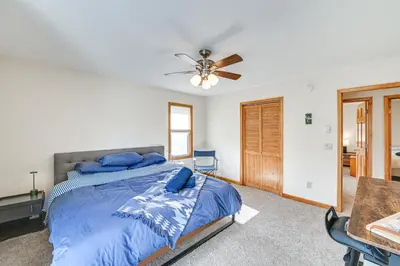 a bedroom with a bed and a ceiling fan at Mtn-View Home with Deck on 4 Acres in Windham in Windham