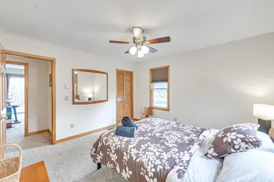 a bedroom with a bed and a ceiling fan at Mtn-View Home with Deck on 4 Acres in Windham in Windham