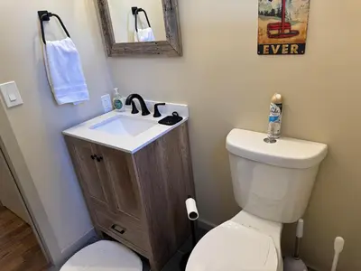 a bathroom with a white toilet and a sink at Private Chalet - 4 mins to Mt Snow in Dover