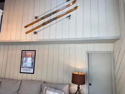 a living room with a couch and a shelf at Private Chalet - 4 mins to Mt Snow in Dover