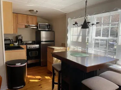 a kitchen with a large island in a kitchen at The Hideaway in Brewster