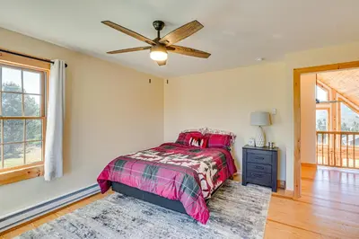 a bedroom with a bed and a ceiling fan at Brushridge Mountain House Ski, Hike and Fish in Fleischmanns