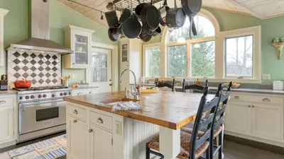 a kitchen with a large wooden table in a kitchen at Catskill Park Farm by AvantStay Huge Yard Fire Pit Near Windham Ski Resort in Prattsville
