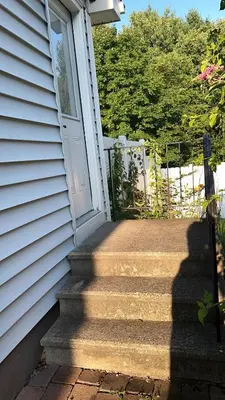 a door to a house with a set of stairs at Premium Private Suite with Parking and Workspace in South Windsor