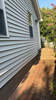 a house with a brick walkway next to a house at Premium Private Suite with Parking and Workspace in South Windsor