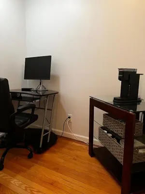 an office with a desk with a computer and a chair at Premium Private Suite with Parking and Workspace in South Windsor