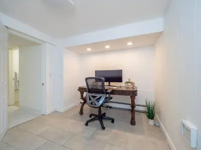 an office with a desk with a computer on it at New Canaan's Downtown Retreat in New Canaan
