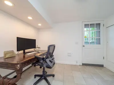 an office with a desk with a computer and a chair at New Canaan's Downtown Retreat in New Canaan