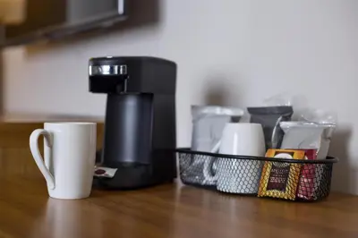 a coffee maker and a cup on a table at Hyatt Place New York Yonkers in Yonkers