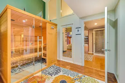 a room with a glass door and a room with a closet at 7 Mi to Skiing Lake George Home with Large Patio in Queensbury