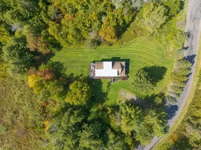 an overhead view of a house in a field at New! 3BR Contemporary Log Home in Catskill Mtns in Margaretville