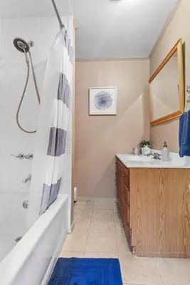 a bathroom with a tub and a sink and a shower at New! 3BR Contemporary Log Home in Catskill Mtns in Margaretville