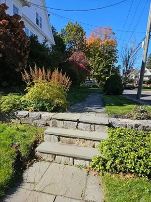a stone path in front of a house at Heart Historic Ridgefield Studio WALK to town in Ridgefield