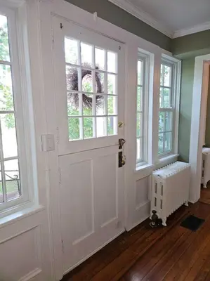 a room with a white door and windows at Heart Historic Ridgefield Studio WALK to town in Ridgefield