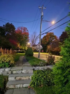 a stone path in a park with a street light at Heart Historic Ridgefield Studio WALK to town in Ridgefield