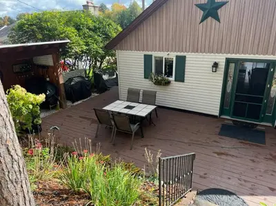 a patio with a table and chairs in front of a house at Lake Moraine Home #7 Near Colgate University in Hamilton