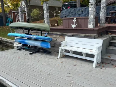 a deck with a bench and two inflatable tubes at Lake Moraine Home #7 Near Colgate University in Hamilton