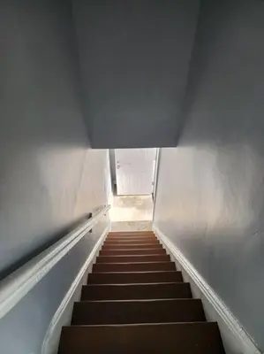 a stairway leading up to a building with a stair case at Two-Bedroom Home 25 min to NYC free parking-UNIT-2 in Teaneck