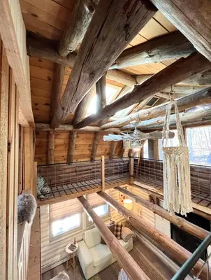 an overhead view of a living room in a log cabin at Cozy, Modern Cabin Retreat 8 min to Windham mtn in Ashland