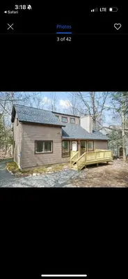 a picture of a house with a house at POCONOS everything close to Luxury vacational home in the heart of poconos with 3 outdoor pools for the public of the Tobyhanna community in Tobyhanna