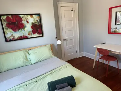 a bedroom with a bed and a table and a desk at private room in middletown 4 minute to wesleyan univ in Middletown