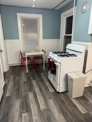 a kitchen with a stove and a table at private room in middletown 4 minute to wesleyan univ in Middletown