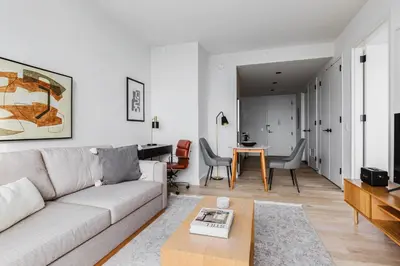 a living room with a couch and a table at Blueground Downtown BK gym wd nr BAM NYC-1685 in Brooklyn