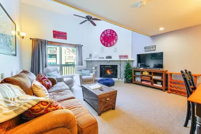 a living room with a couch and a tv at Walk to Mt Snow Cozy West Dover Condo in West Dover