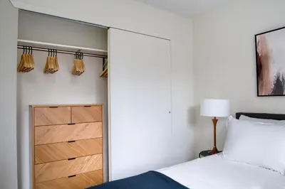 a bedroom with a bed and a closet at Blueground Midtown E gym wd nr UN NYC-1150 in New York