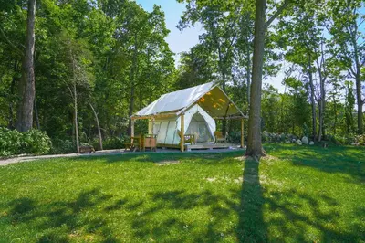 a yurt in the middle of a field with trees at Hilltop Hideaway at Moon Valley Campground in Vernon Township