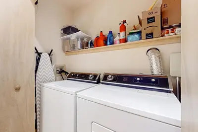 a washer and dryer in a laundry room at Haystack 9 in Wilmington