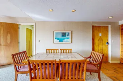 a dining room with a table and four chairs at Snow Tree 32A in Dover