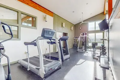 a gym with treadmills and elliptical machines at Snow Tree 32A in Dover